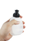 Person holding one bottle from Two Pack 6oz Running Water Bottles For Hydration Belts And Waist Packs, with leak-proof sip lid
