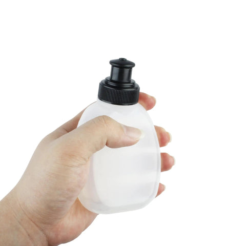 Person holding one bottle from Two Pack 6oz Running Water Bottles For Hydration Belts And Waist Packs, with leak-proof sip lid