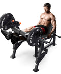 Man using All In One Leg Day Beast Machine with leg press, leg extension, seated leg curl, and adjustable workout bench for thighs and hamstrings
