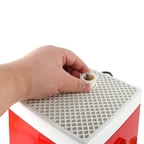 Hand adjusting diamond bit on Industrial Mini Portable Stained Glass Grinder with Diamond Bit for Glass Art and Craft Projects.