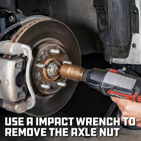 Impact wrench using Half Inch Drive 36mm 6 Point Extra Deep Axle Nut Socket Heavy Duty Tool for axle nut removal on car wheel.