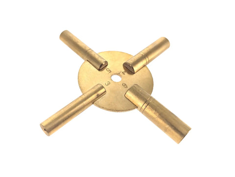 Close-up of a Universal 4 Prong Brass Clock Winding Key Set for winding vintage and modern clocks with odd and even number dials