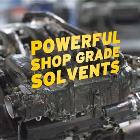 Engine block covered in heavy grease with text 'Powerful Shop Grade Solvents' demonstrating solvent strength.