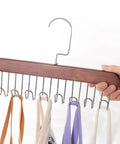 Solid Wooden Closet Organizer Dual Pack Featuring Eight Smooth Stainless Steel Hooks holding scarves in a hand.