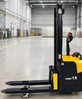 Side view of Top Tier Electric Walkie Pallet Stacker With Huge 1500Kg Capacity in a warehouse for lifting heavy loads.
