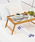 Foldable Replacement Table Legs For Laptop And Furniture Heavy Duty Plastic And Iron Desk Legs next to a wooden tray table on bed
