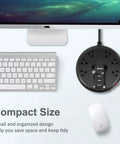 Compact Power Strip With Six Outlets And Three USB Ports, displayed near computer, ideal for space saving charging station.