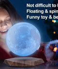 Girl admiring Levitating Moon Lamp With Remote, 6 Inch Floating 3D LED Moon Light With 18 Colors, Magnetic Spinning Base
