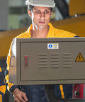 Technician checks panel with Factory Grade Industrial Equipment Maintenance Warning Sticker With PET Material And UV Resistant Bright Print Self Adhesive Filter Cleaning Label For Factories And Built Tough Industrial Settings.