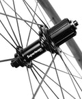 Close-up of Carbon Wheelset 45to50CU-25-CC 700C Tubeless Rim Brake For Road Bikes showing hub and spokes