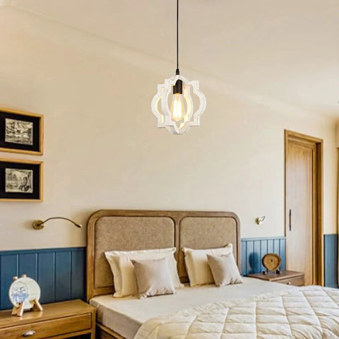 Farmhouse Chandelier Pendant Light With Distressed White Wood And Black Accent hanging in cozy bedroom