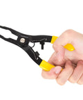 Hand holding sprinkler head adjustment tool and rotor removal kit with yellow grips, S50C steel, for lawn irrigation systems includes screwdriver.