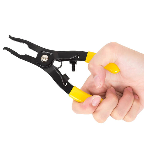 Hand holding sprinkler head adjustment tool and rotor removal kit with yellow grips, S50C steel, for lawn irrigation systems includes screwdriver.