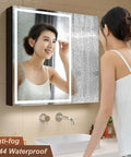 Woman using LED Lighted Bathroom Medicine Cabinet With Backlit Panel, USB Sockets, Anti Fog, Dimmable 3 Color Light Makeup Mirror.