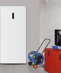 Big Boy Upright Freezer With Convertible Fridge Mode, Four Handy Shelves, Garage Ready No Hassle Defrost, Loads Of Room For Meat Cuts, Massive 21 Cubic Foot Capacity, White in a garage setting.