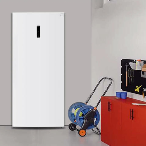 Big Boy Upright Freezer With Convertible Fridge Mode, Four Handy Shelves, Garage Ready No Hassle Defrost, Loads Of Room For Meat Cuts, Massive 21 Cubic Foot Capacity, White in a garage setting.