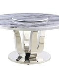 Level Up Your Dining Room With This Top Tier Round White Marble Dining Table Sporting A Sleek Stainless Steel Base And Easy Rotate Lazy Susan For Chill Evening Hangouts. Round white marble dining table with stainless steel base and lazy Susan.