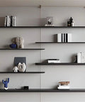 Sleek Black Four Tier Wall Mounted Storage Rack With Solid Aluminum Alloy Shelves For Living Room Decor featuring modern decor items.