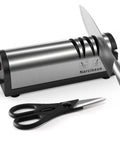 Fast 2 Stage Electric Knife Sharpener For Home Kitchen with stainless steel finish, shown sharpening a knife and with scissors nearby.