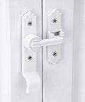 White gate latch and handle for barn door on white wooden door
