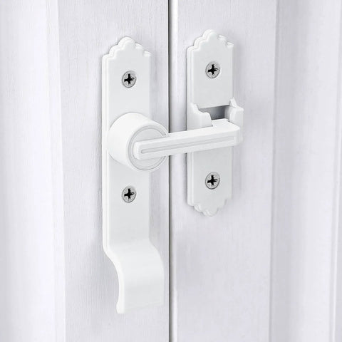 White gate latch and handle for barn door on white wooden door