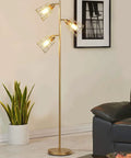 Industrial Floor Lamp With Reading Light, tall golden standing lamp next to sofa, three caged bulbs, living room setting