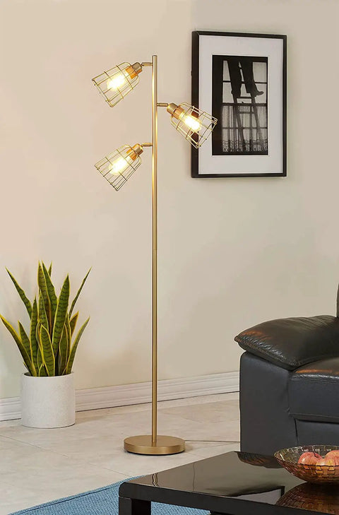 Industrial Floor Lamp With Reading Light, tall golden standing lamp next to sofa, three caged bulbs, living room setting