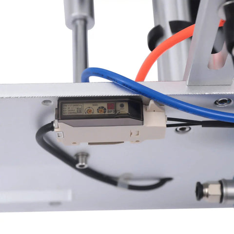 Close-up of fiber sensor on Semi Automatic Label Applicator Round Bottle Labeling Machine With High Precision Fiber Sensor And 300W Motor.