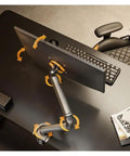 Fully Adjustable Single Monitor Mount For Desk Featuring Mechanical Spring Arm With Super Smooth Tilt And Rock Solid Bracket Design Supporting 17 To 32 Inch Screens Up To Twenty Pounds Easy Install, showing adjustable arm movement.