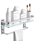 Glass Shelf With Towel Bar For Bathroom, 15.2 By 4.5 Inches, Wall Mount Organizer In Silver with toiletries and towel.