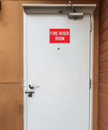 Heavy Duty Rustproof Aluminum Fire Riser Room Signs Two Pack on a white door, 10x7 inches, weatherproof outdoor use.
