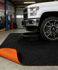 Oil Spill Mat For Garage Floor 64x32 Inches Under Car Absorbent And Waterproof Shop Grade Floor Protector in use under truck
