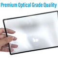Hand holding 2 Pack Large Full Page Magnifying Sheet With 3X Magnification And 3 Fresnel Lens Bookmark Magnifiers, close-up view