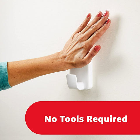 Extra Large Heavyweight Wall Hooks With Adhesive Strips for damage-free hanging, hand pressing white hook on wall