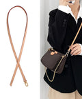 Top Shelf Genuine Vachetta Leather Shoulder Strap Straight Up Fine Short Purse Strap Thin Crossbody Handbag Replacement For Luxury Pochette Bag Apricot Tone on display with a model.