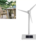 Solar Powered Windmill Model For Desk And Classroom Use Desktop Turbine Kit on outdoor table, spinning blades visible