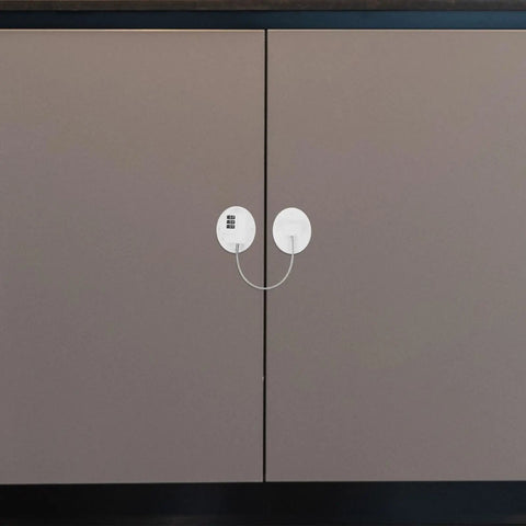 Kid Proof Fridge And Cabinet Lock With Password Protection, white plastic lock on brown cabinet doors for safety.