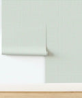 Badass Country Sage Green Matte Linen Wallcovering Pvc Free Heavy Duty Covering Holds Up In Wet Rooms Like Charm Brings Tight Modern Texture With Zero Fuss Paste To Paper Install, showing roll on wall.