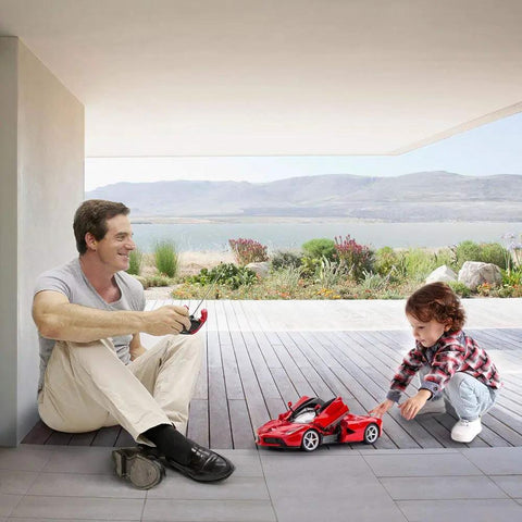 Father and child playing with Ferrari LaFerrari Licensed One Fourteenth Scale RC Car With Realistic Interior And Exterior Details
