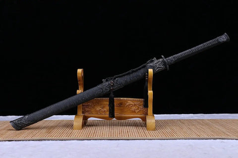 Beefy Damascus Tang Dao Sword With Black Gold Finish on a wooden stand, full tang build with rope wrap handle
