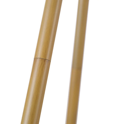 Close-up of faux wood tripod base for 60 Inch Floor Lamp With Faux Wood Tripod Base And Rattan Shade On Off Rotary Switch For Easy Control Cottagecore Cozy Vibe Living Room Lighting Modern Farmhouse Style Warm Ambience Sturdy Floor Lamp.