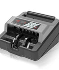 Black and gray portable money counter with UV and MG counterfeit detection in operation