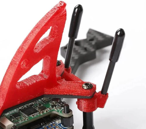 Close-up of RC antenna tube black 320mm with silver mount and cap for RC cars and FPV drones receiver attached to red frame.