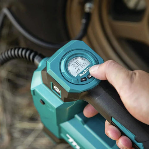 Makita DMP181ZX 18V cordless high-pressure inflator, teal plastic housing, close-up of gauge and trigger.