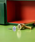 M5 Slotted T Nut Slide Nuts Set For T Track Fastening, tool and screws on green table with open green cabinet