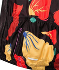 Multicolored floral print fabric with black mesh background, close-up view highlighting vibrant red, yellow, and blue patterns.