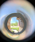 View through Solid Brass 220-Degree Door Viewer Peephole With Heavy Duty Rotating Privacy Cover, illustrating ultra wide HD lens clarity.