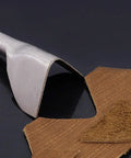 V Shape Leather Craft Punch Set half round cutter in use on brown leather, showing precise cut edges, pro-grade iron.