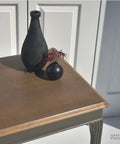 Ponderosa Premium Interior Wood Aging Stain 5 Gallon Container Delivers Dead Simple Application, sun-tanned brown finish on a table.