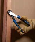 Heavy Duty 8 Inch Diagonal Cutting Pliers With High Leverage Design Made In USA cutting wire next to a wooden plank
